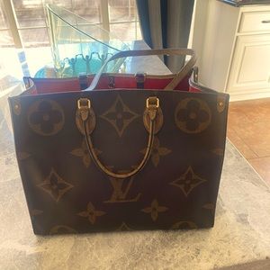 This is Authentic GM reverse on the goal Louis Vuitton leather satchel bag.
